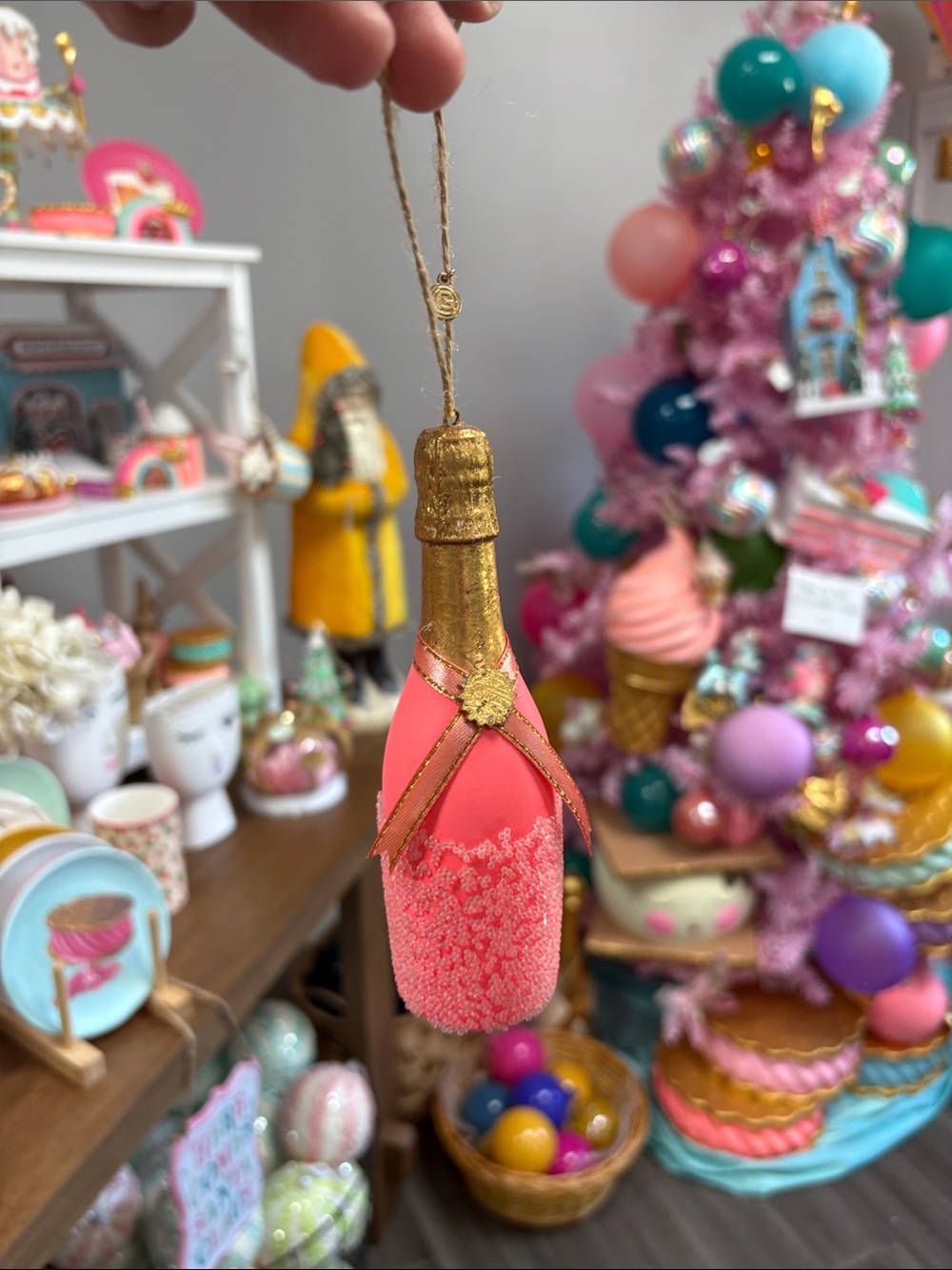 Coral/pink champagne bottle ornament by Glitterville